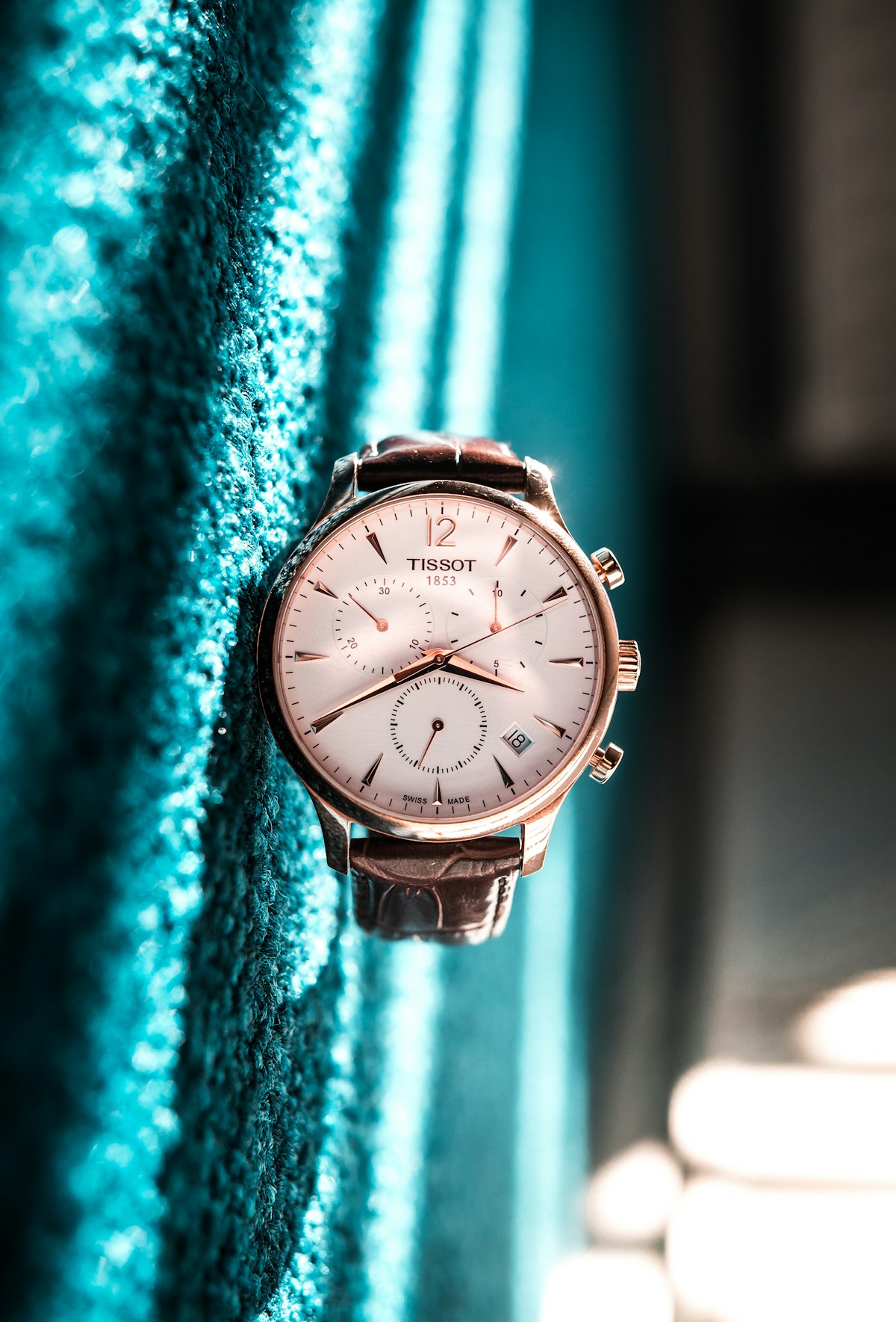 Elegant dress watch with moon phase complication and dark leather strap