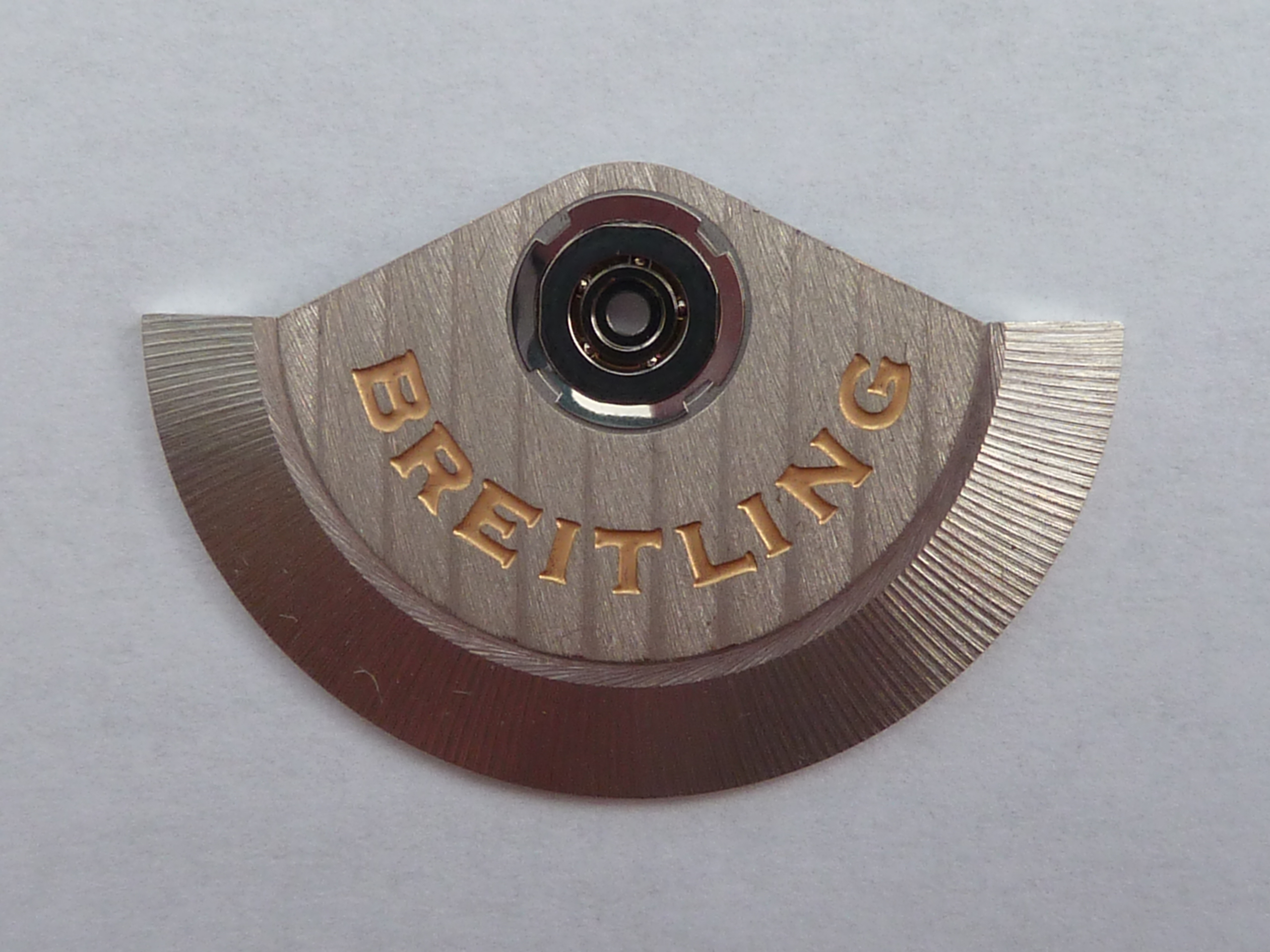 Close-up of the Breitling rotor of a Valjoux 7750 automatic chronograph movement