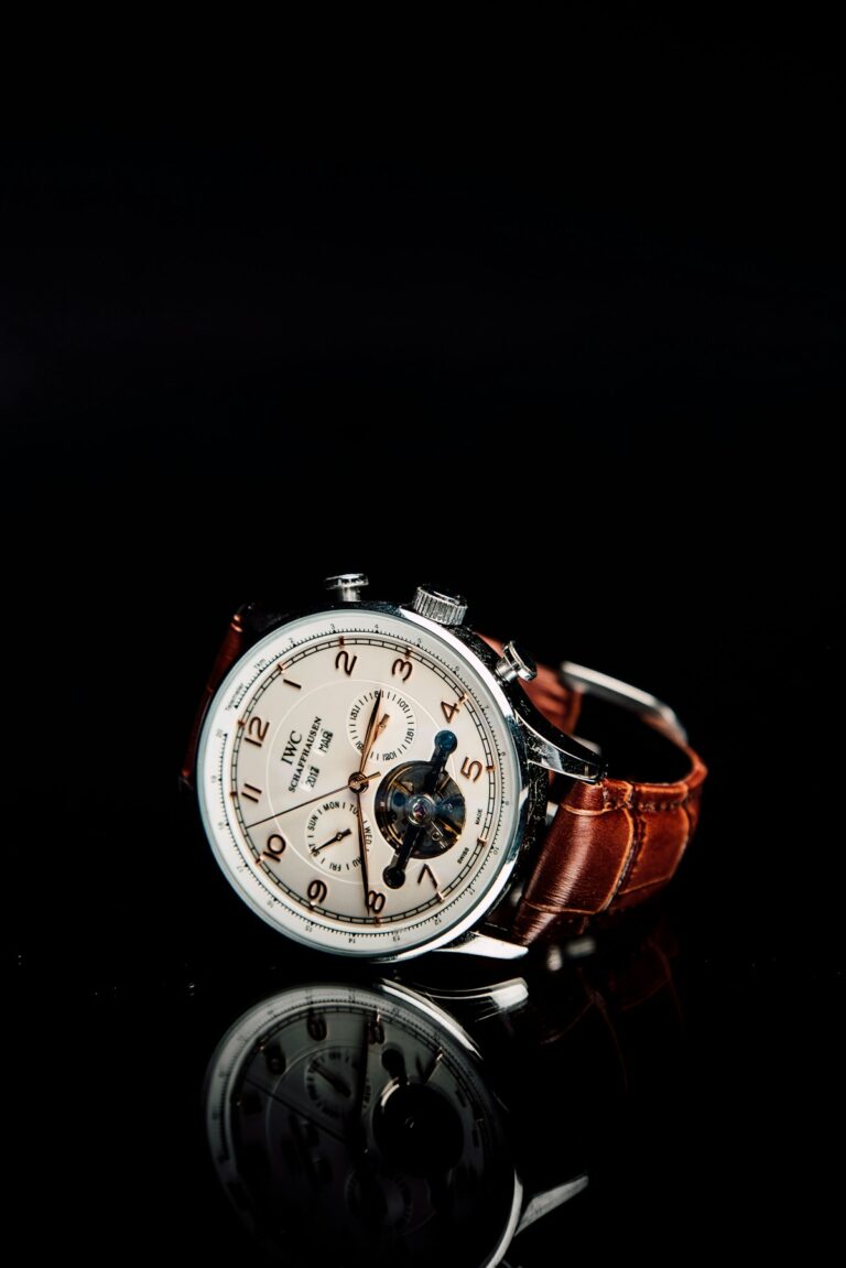 Elegant Cartier dress watch with round gold case on a navy strap