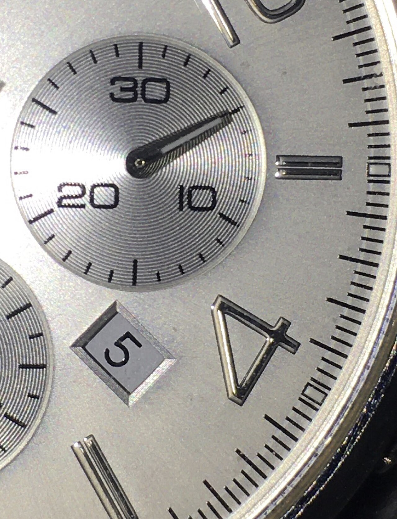 Detailed macro view of a chronograph watch dial