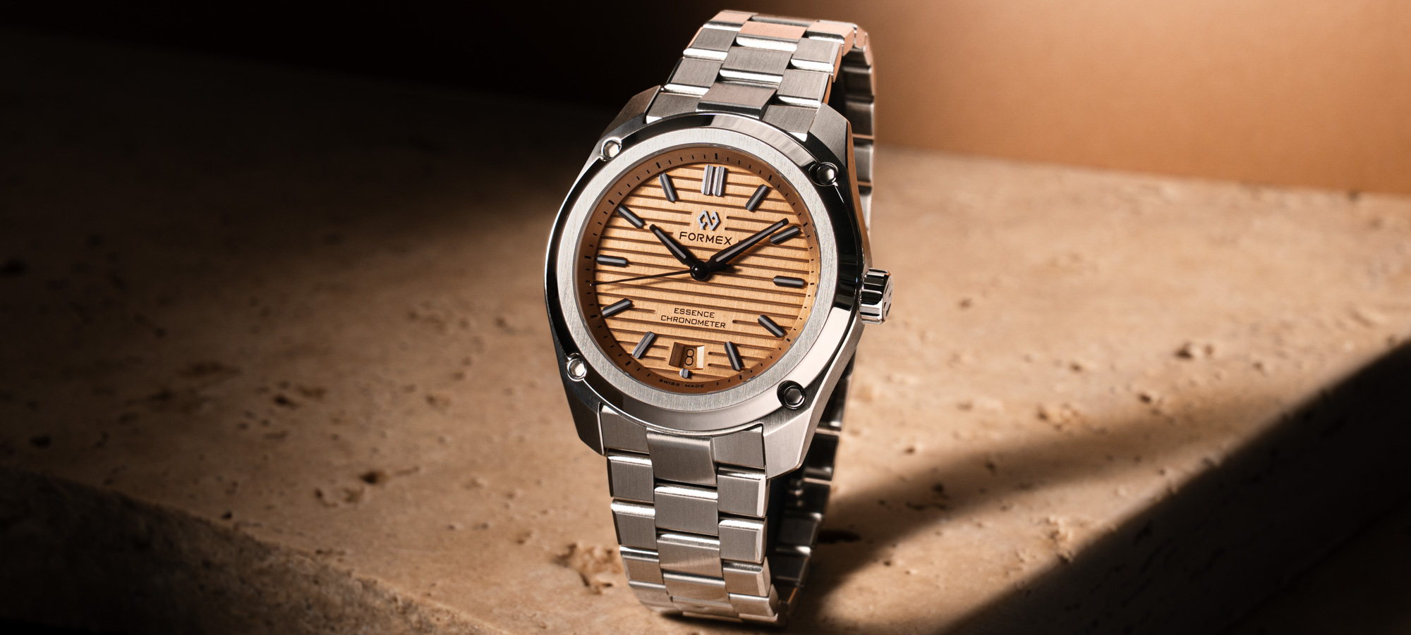 The Formex Essence 39 Automatic COSC in its signature blue dial on a stainless steel bracelet with the case suspension system