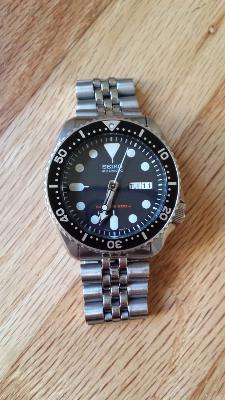 Seiko SKX007 automatic dive watch with black dial and Pepsi bezel on stainless steel Jubilee bracelet