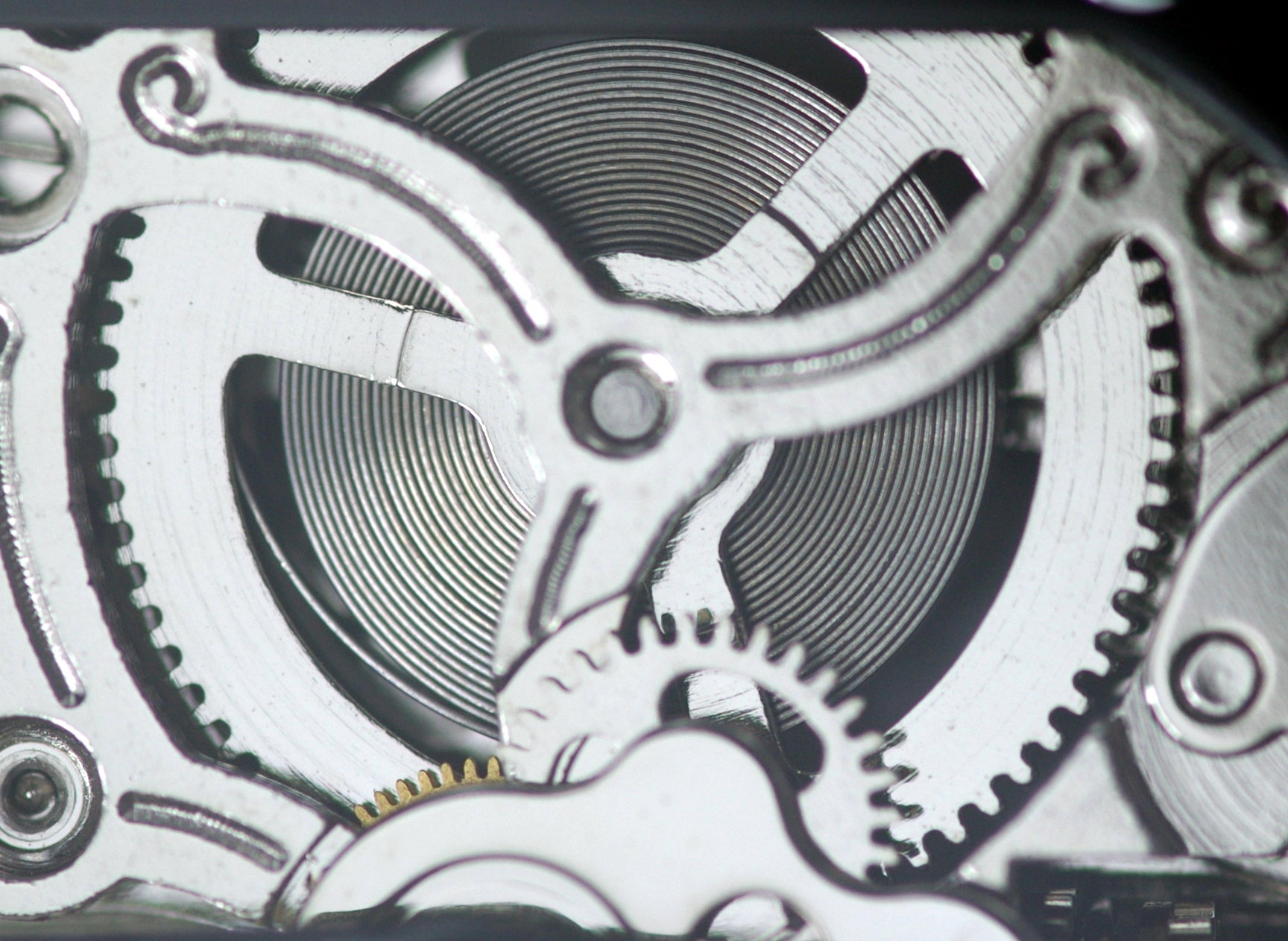 Mainspring and slip clutch bridle inside a Sea-Gull ST16 automatic watch movement preventing overwinding