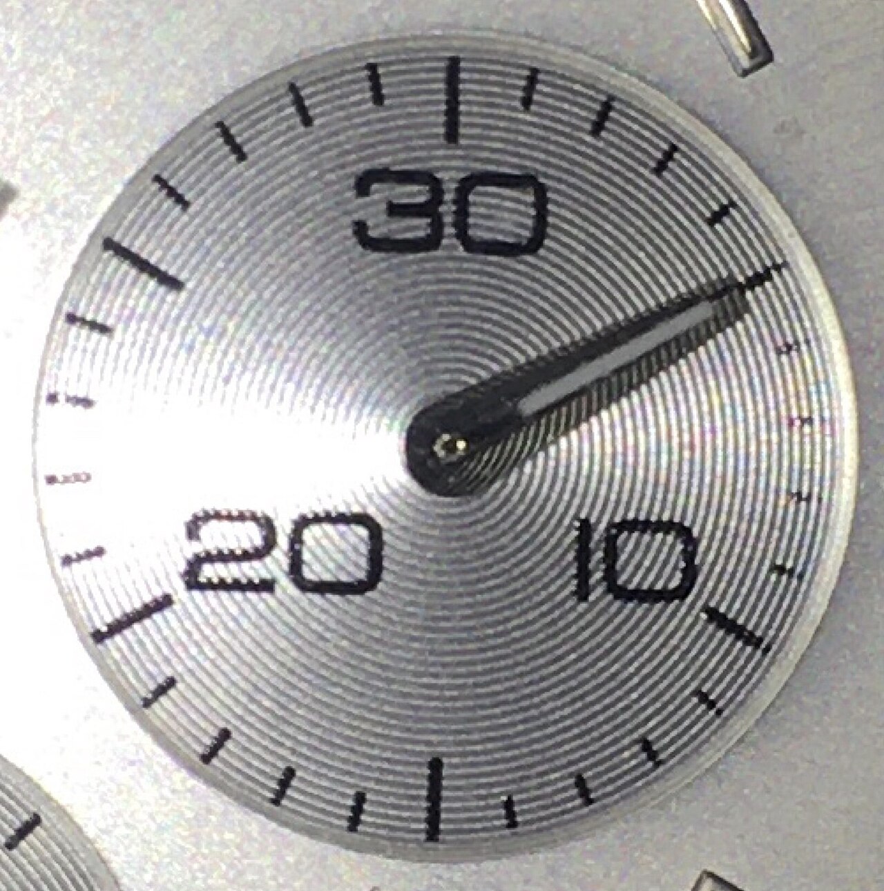 Close-up cropped view of a watch dial