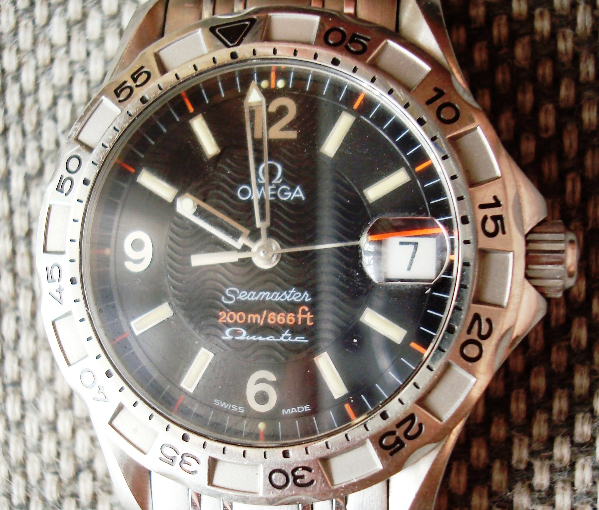 Omega Seamaster dive watch with black dial and bracelet
