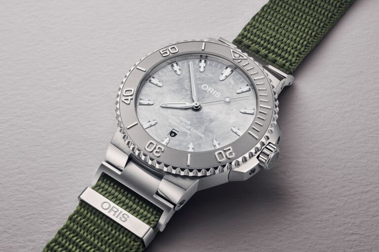 Oris Social Club Edition II Aquis Date Relief watch with frosted silver dial and olive green NATO strap