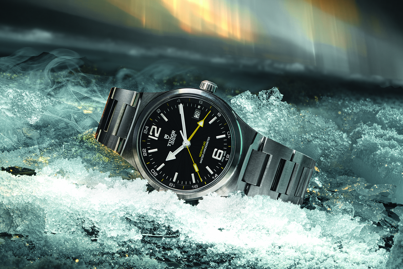 Tudor Northflag GMT M9140G1A0U full front view with black dial, yellow GMT hand and integrated steel bracelet